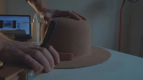 Designer makes a felt hat. Fedora hat Stock Footage 86486446