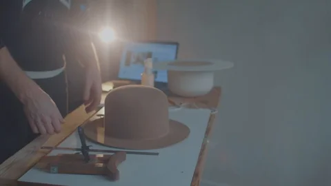 Designer makes a felt hat. Fedora hat Stock Footage 86486679