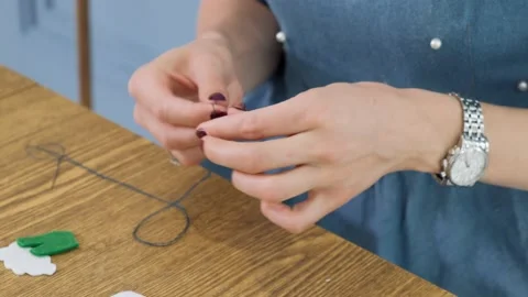 Designer makes, sews soft childrens toys from fabric. In the form of fruits  Stock Footage 131065801