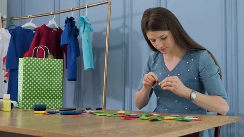 Designer makes, sews soft childrens toys from fabric. In the form of fruits Stock Footage 131066785