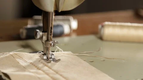 Designer making close. Close up on a sewing machine showing process Stock Footage 78772946