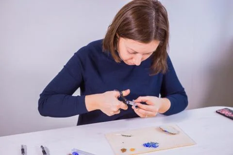 Designer making handmade brooch Stock Photos