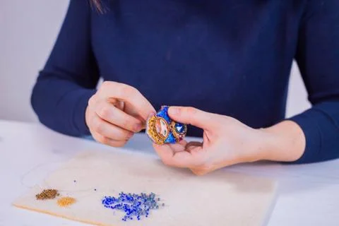 Designer making handmade brooch Stock Photos
