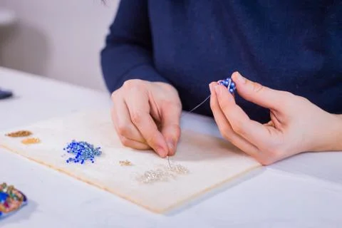 Designer making handmade eardrop Stock Photos