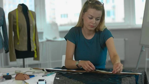 Designer measures the tissue Stock-Footage 93561579