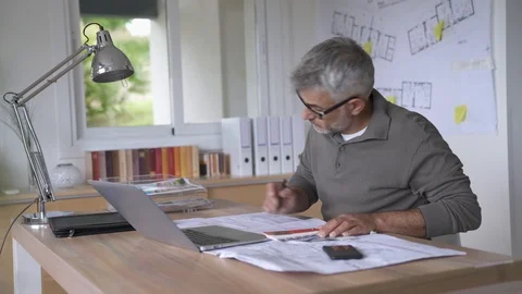 Designer in office working on project Stock Footage 90738322