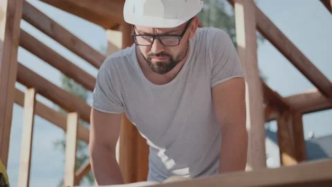 Designer or foreman at a construction site. Build a house with draws Video stock 139038057