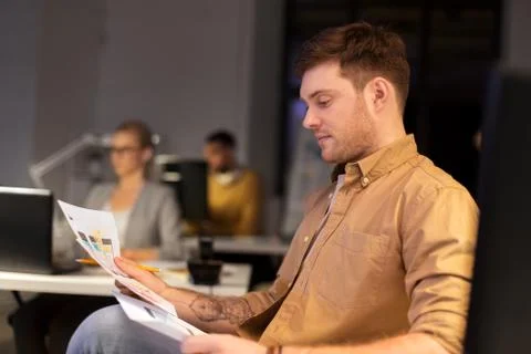 Designer or software developer at night office Foto stock