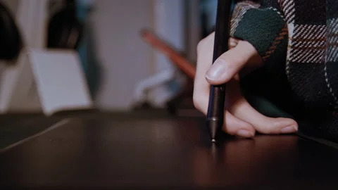 Designer with physical disability using graphics tablet Stockbeeldmateriaal 321936394