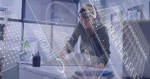 Designer picking up pencil marking plans drafting table HUD overlays floating Vídeo Stock 334111259