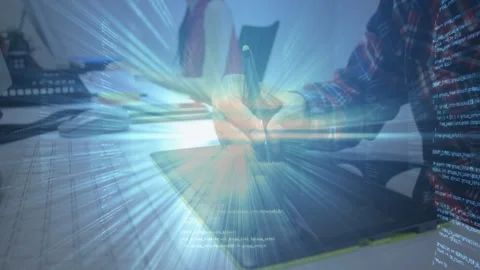 Designer pressing stylus onto graphics tablet, activating blue tech code overlay Stock Footage 334788950