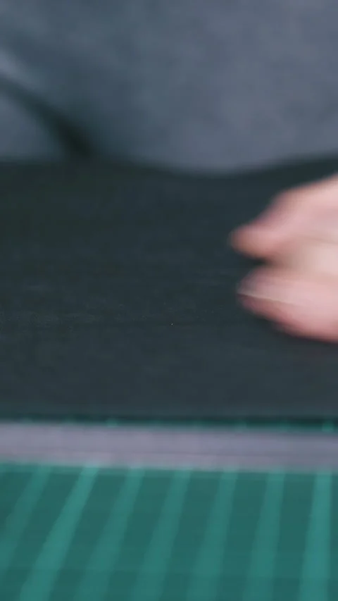 Designer puts black leather fabric on special cushion board Stock Footage 317084839