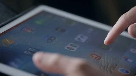Designer search references for his work on tablet Video stock 94974239