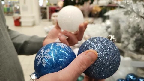 The designer selects the decor to decorate the creative space. Christmas balls Stock Footage 220830516