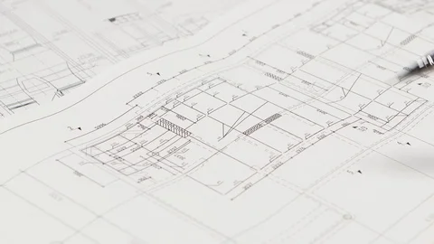 Designer sits at the table, chooses a drawing that is more optimal for him Vidéo 73674533