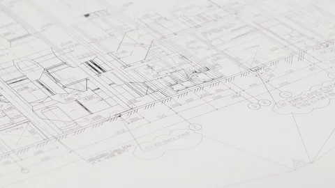 Designer sits at the table, chooses a drawing that is more optimal for him Stock Footage 73674696