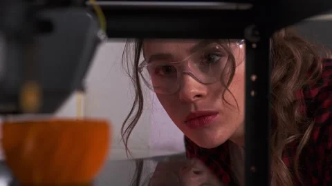 Designer student using a 3D printer in college. Female designer print prototype Stock Footage 153421934
