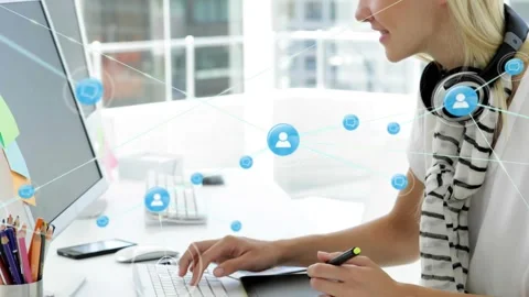 Designer switching mouse and stylus on desk, animating blue network icons while Stock Footage 321377999