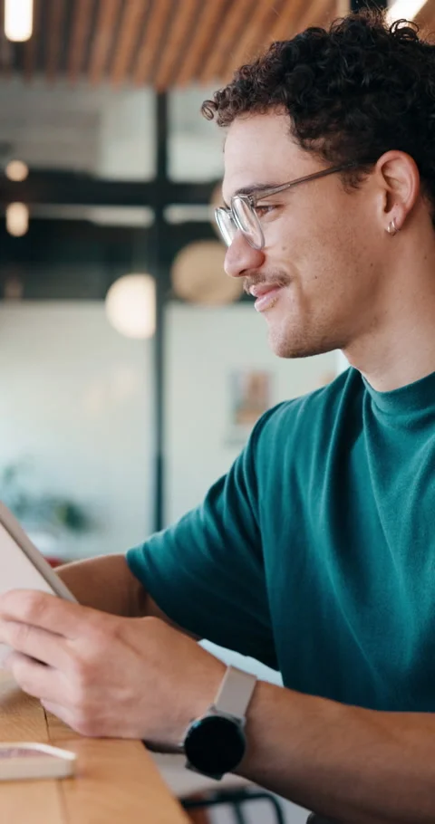 Designer, tablet and cafe with happy man for web development, research or 库存影片 335825784