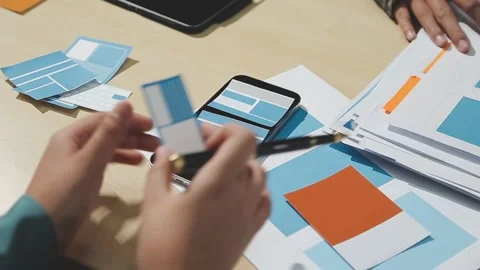 The designer team is designing the uxui system to make the uxui system work.. Stock Footage 283667015