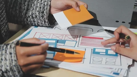 The designer team is designing the uxui system to make the uxui system work.. Stock Footage 283667021