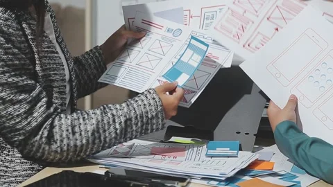 The designer team is designing the uxui system to make the uxui system work.. Stock Footage 283667027