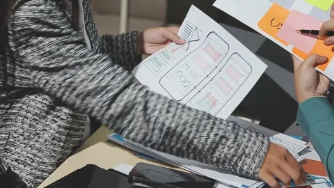 The designer team is designing the uxui system to make the uxui system work.. Stock Footage 283667031