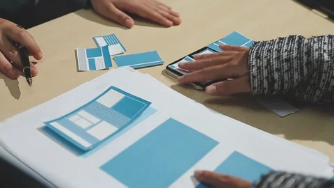 The designer team is designing the uxui system to make the uxui system work.. Stock Footage 283667114