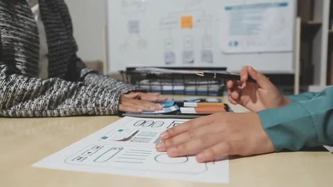 The designer team is designing the uxui system to make the uxui system work.. Stock Footage 283667191