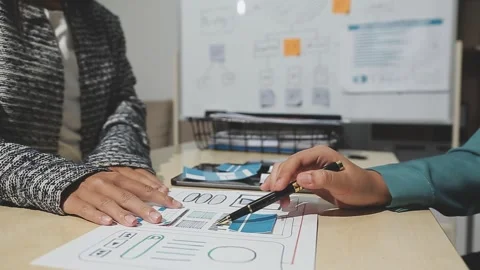The designer team is designing the uxui system to make the uxui system work.. Stock Footage 283667193