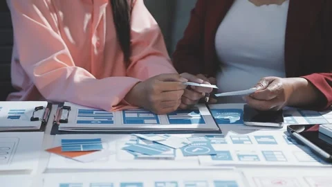 The designer team is designing the uxui system to make the uxui system work.. Stock Footage 290951502