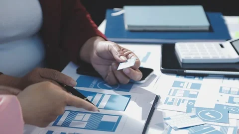 The designer team is designing the uxui system to make the uxui system work.. Stock Footage 290951588