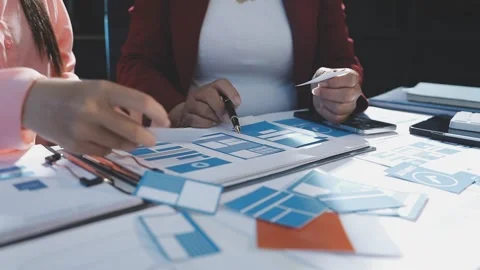 The designer team is designing the uxui system to make the uxui system work.. Stock Footage 290951593
