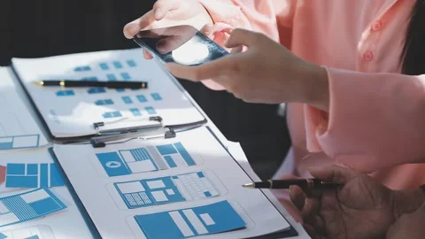 The designer team is designing the uxui system to make the uxui system work.. Stock Footage 290951841