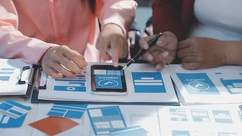 The designer team is designing the uxui system to make the uxui system work.. Stock Footage 290951967