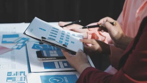 The designer team is designing the uxui system to make the uxui system work.. Stock Footage 290952066