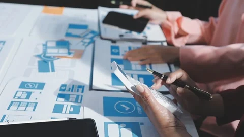 The designer team is designing the uxui system to make the uxui system work.. Stock Footage 290952098