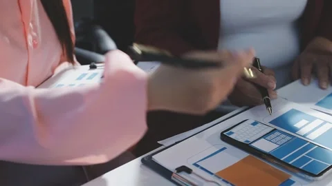 The designer team is designing the uxui system to make the uxui system work.. Stock Footage 290952182