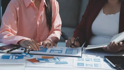 The designer team is designing the uxui system to make the uxui system work.. Stock Footage 290952237