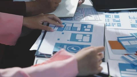 The designer team is designing the uxui system to make the uxui system work.. Stock Footage 290952341