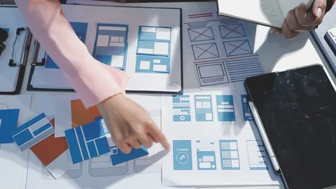 The designer team is designing the uxui system to make the uxui system work.. Stock Footage 290952403