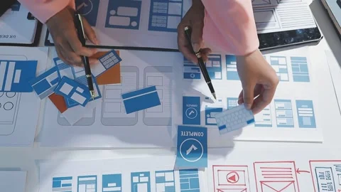 The designer team is designing the uxui system to make the uxui system work.. Stock Footage 290952447