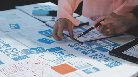 The designer team is designing the uxui system to make the uxui system work.. Stock Footage 290952458