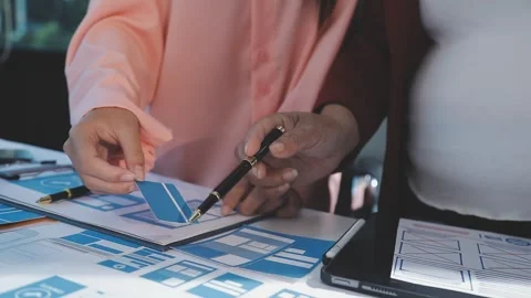 The designer team is designing the uxui system to make the uxui system work.. Stock Footage 290952538