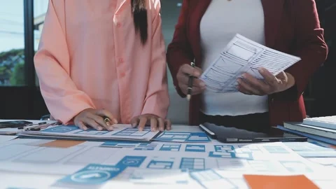 The designer team is designing the uxui system to make the uxui system work.. Stock Footage 290952657