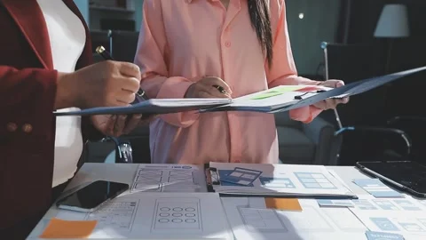 The designer team is designing the uxui system to make the uxui system work.. Stock Footage 290952773