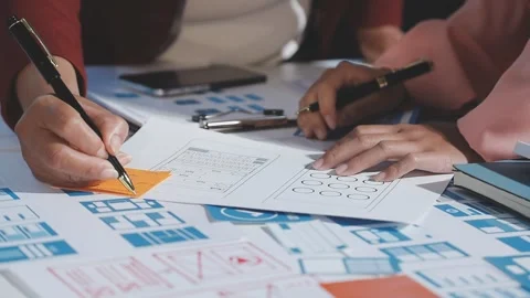 The designer team is designing the uxui system to make the uxui system work.. Stock Footage 290952842