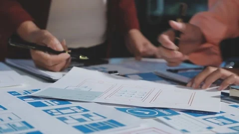 The designer team is designing the uxui system to make the uxui system work.. Stock Footage 290953012