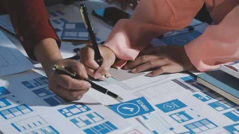 The designer team is designing the uxui system to make the uxui system work.. Stock Footage 290953126
