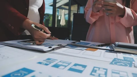 The designer team is designing the uxui system to make the uxui system work.. Stock Footage 290953133
